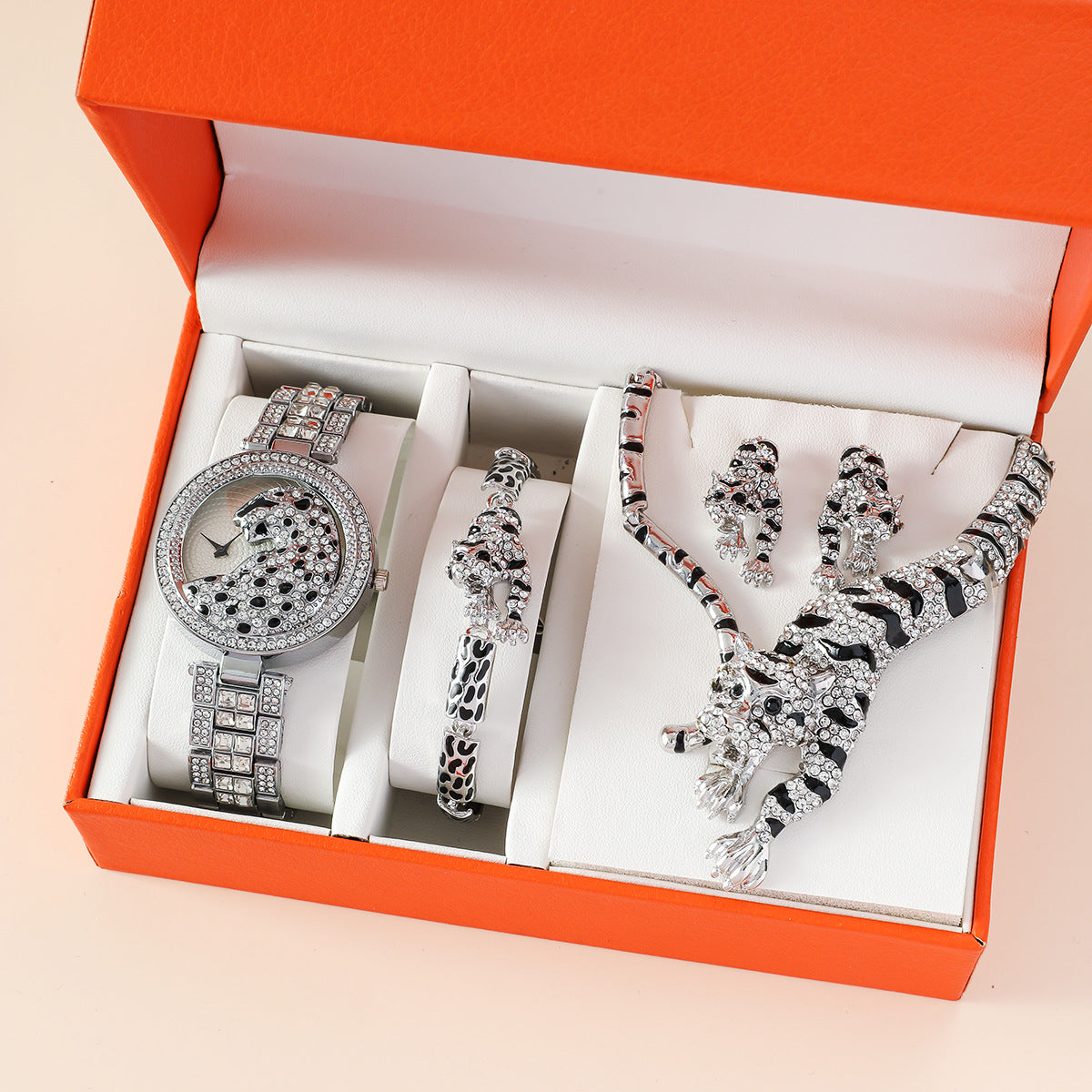 Montre à quartz de qualité, ornée d'un diamant et d'un animal, avec un grand cadran simple et un bracelet en acier.