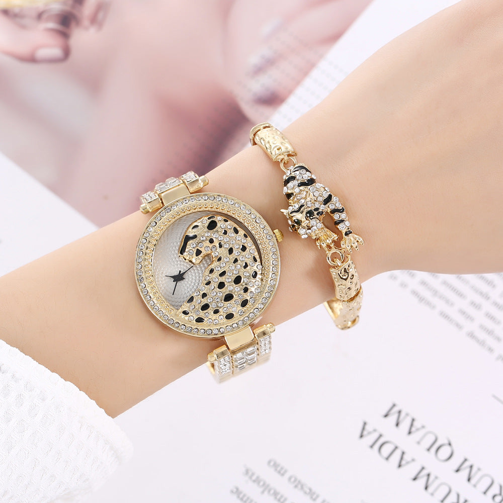 Montre à quartz de qualité, ornée d'un diamant et d'un animal, avec un grand cadran simple et un bracelet en acier.